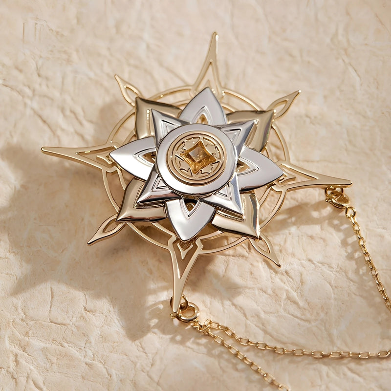 Detail view of star charm and layered chain design on Genshin Impact Albedo Theme Impression brooch with refined brass finish