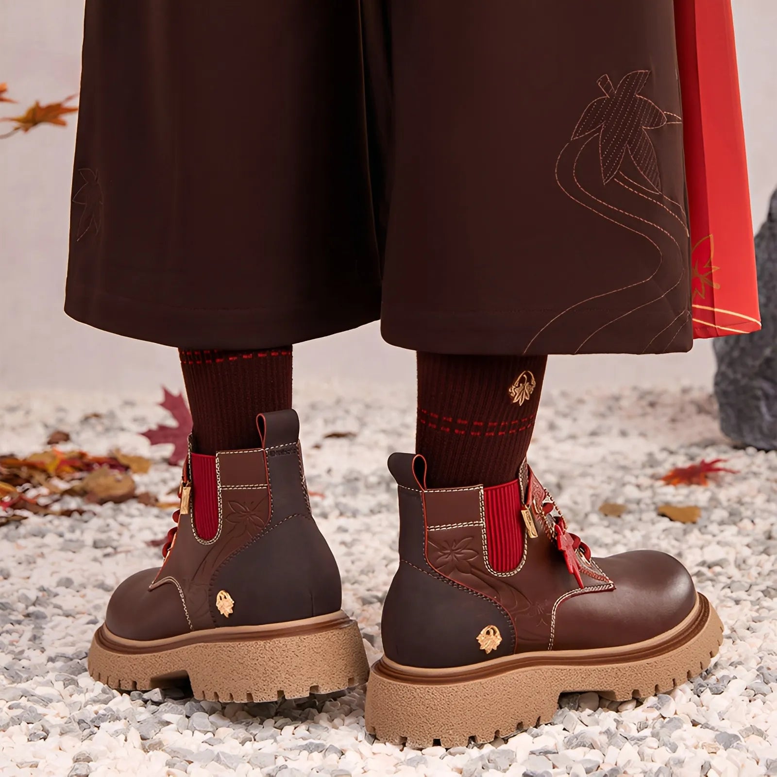 Brown Kaedehara Kazuha cosplay boots with red lace accents and maple accessory