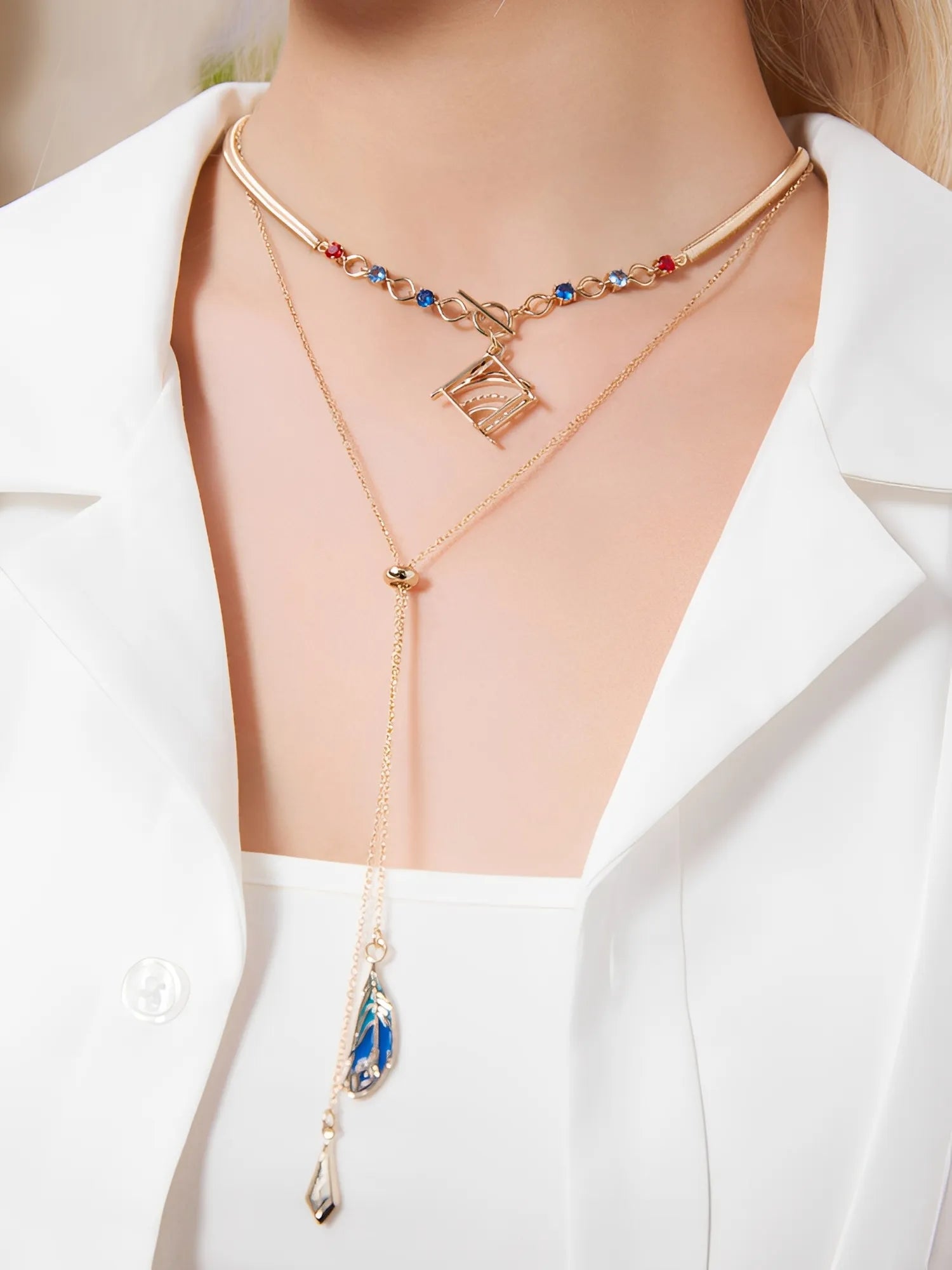 Forest and Sand Series Kaveh jewelry set with layered necklace and asymmetrical earrings worn in outfit