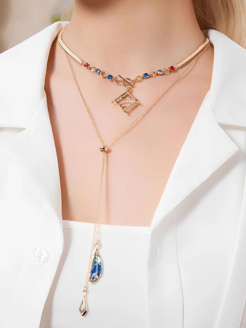 Forest and Sand Series Kaveh jewelry set with layered necklace and asymmetrical earrings worn in outfit