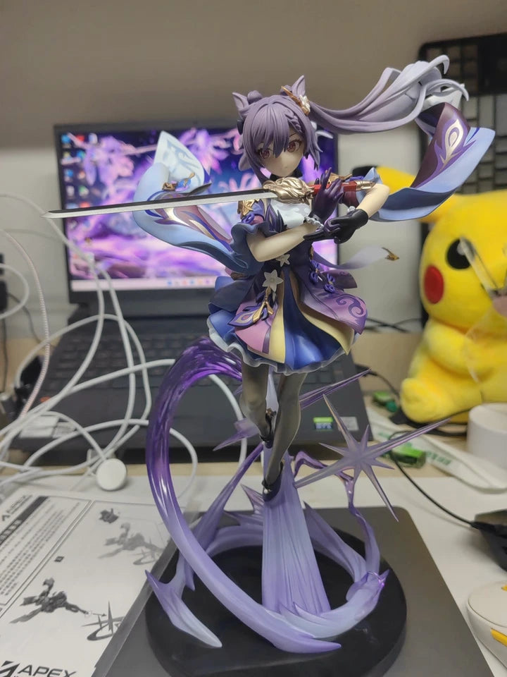 Wide angle customer photo showing Keqing figure as part of display setup