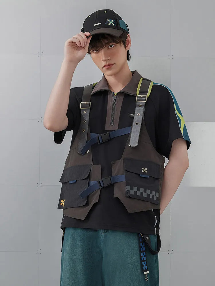 Back view of Kinich utility vest featuring breathable mesh panel and crossed shoulder straps
