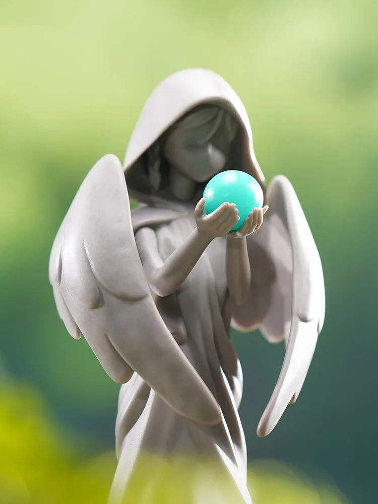 Statue of The Seven Anemo figure with glowing turquoise orb