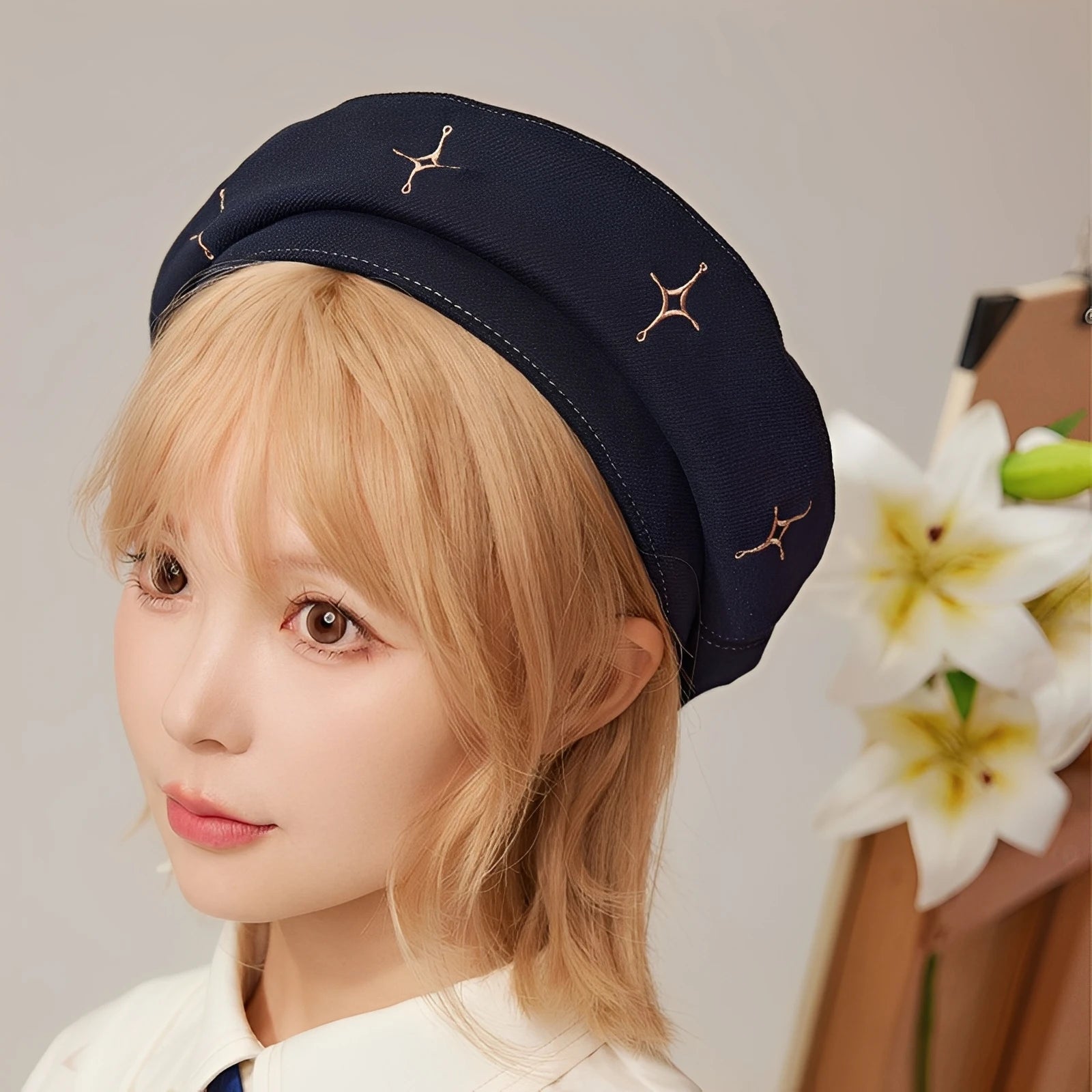 Genshin Impact Albedo theme navy beret with star embroidery worn by model, front close-up view