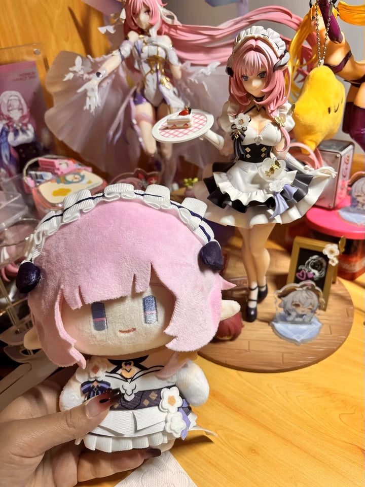 Customer photo of Elysia plush doll displayed alongside character figure