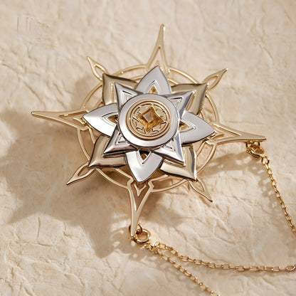 Detail view of star charm and layered chain design on Genshin Impact Albedo Theme Impression brooch with refined brass finish