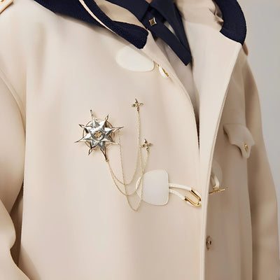 Model wearing Genshin Impact Albedo Theme Impression brooch on beige coat, showcasing layered chains and elegant fantasy styling
