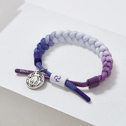 Keqing inspired braided bracelet from Genshin Impact with woven cord and metal charm
