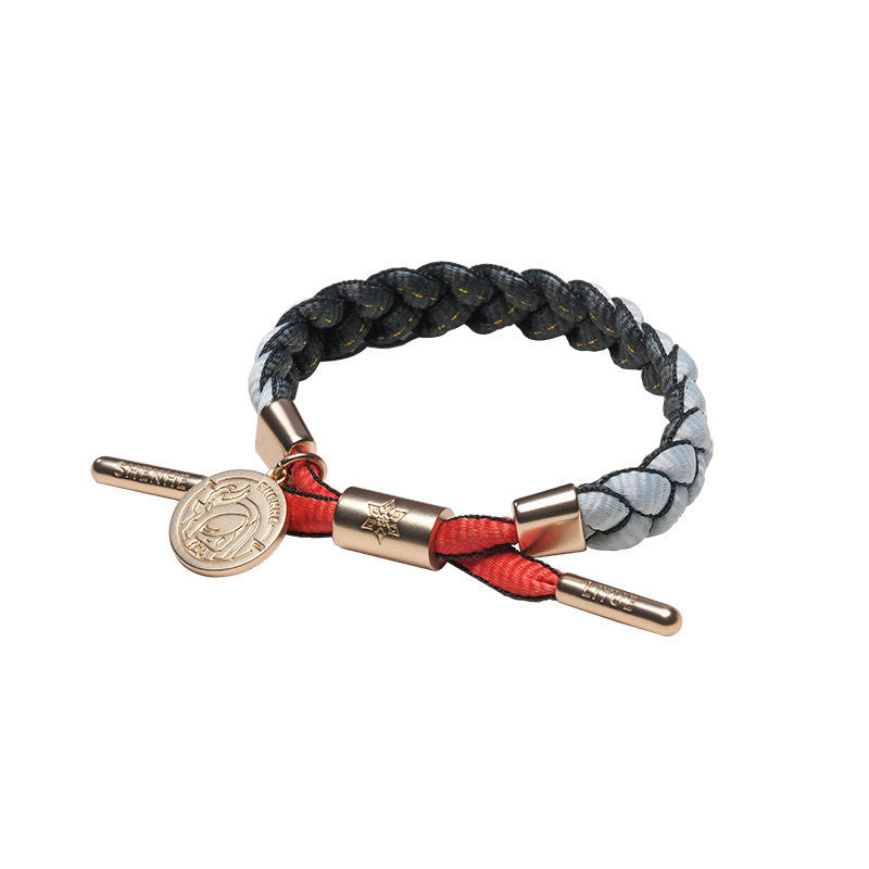 Shenhe inspired braided bracelet from Genshin Impact with woven cord and metal charm