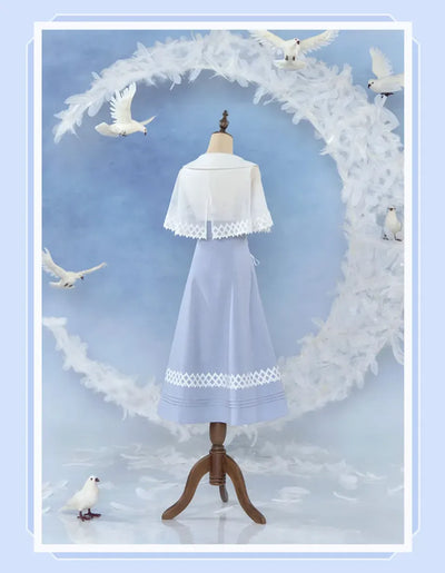 Columbina dress blue skirt with geometric lace and pleated hem details