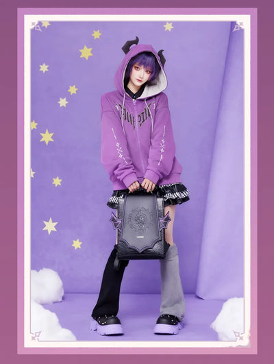 Black textured surface and purple trim details of the Durin PU backpack