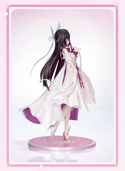 Rear view of Columbina figure flowing dark hair and ribbons
