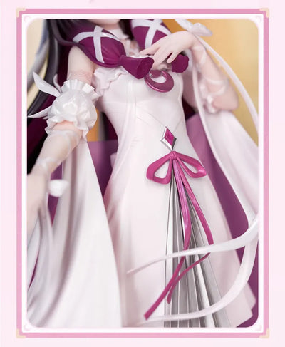 Columbina figure flowing cape and layered costume details