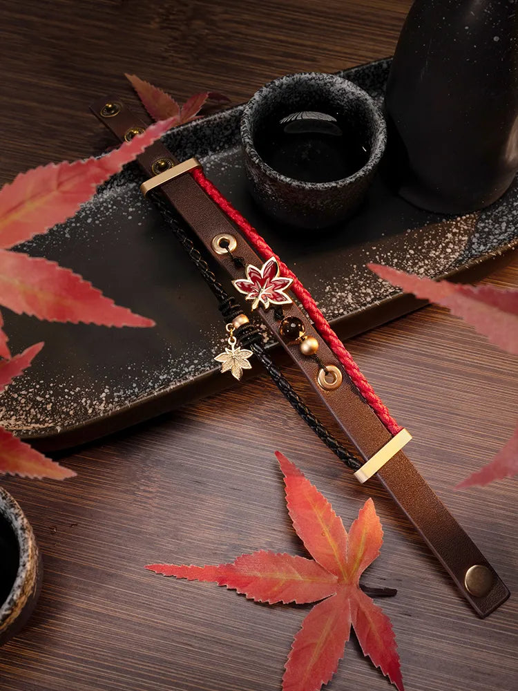 Close-up detail of Kaedehara Kazuha bracelet featuring translucent maple leaf ornament and braided cord