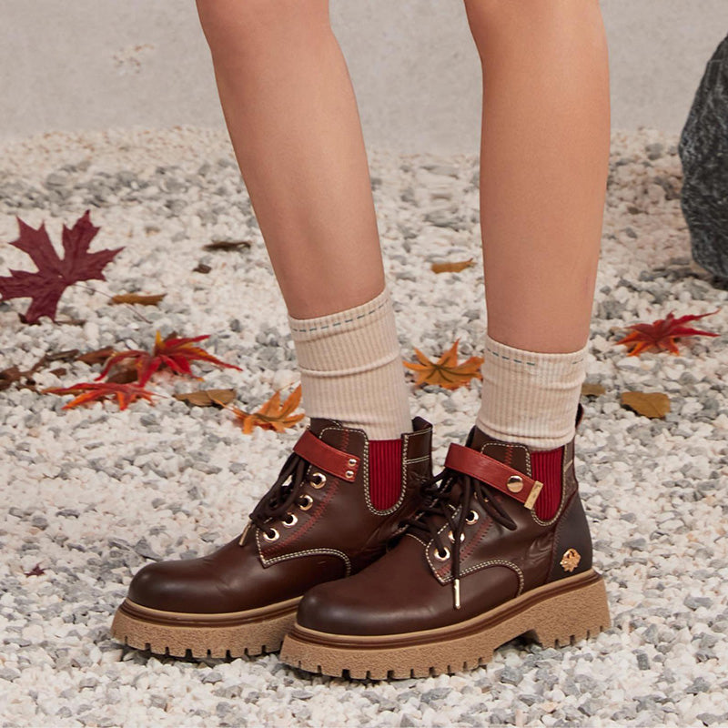 Close up of Kaedehara Kazuha themed socks with embroidered emblem and soft fabric texture