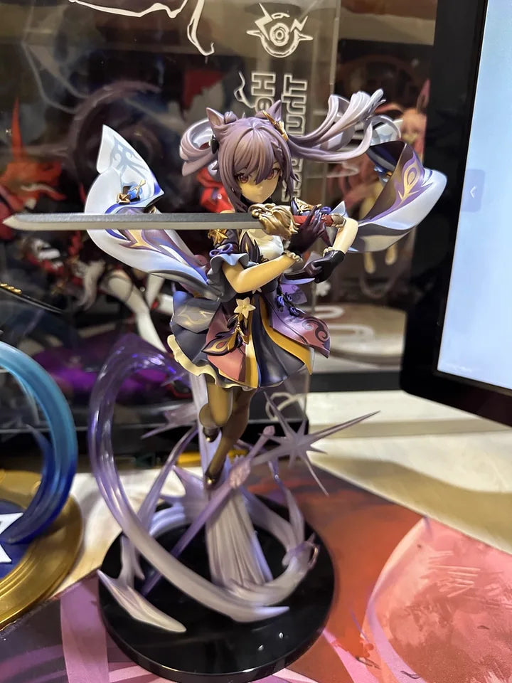 Keqing figure from Genshin Impact displayed on stand, customer photo showing full body details