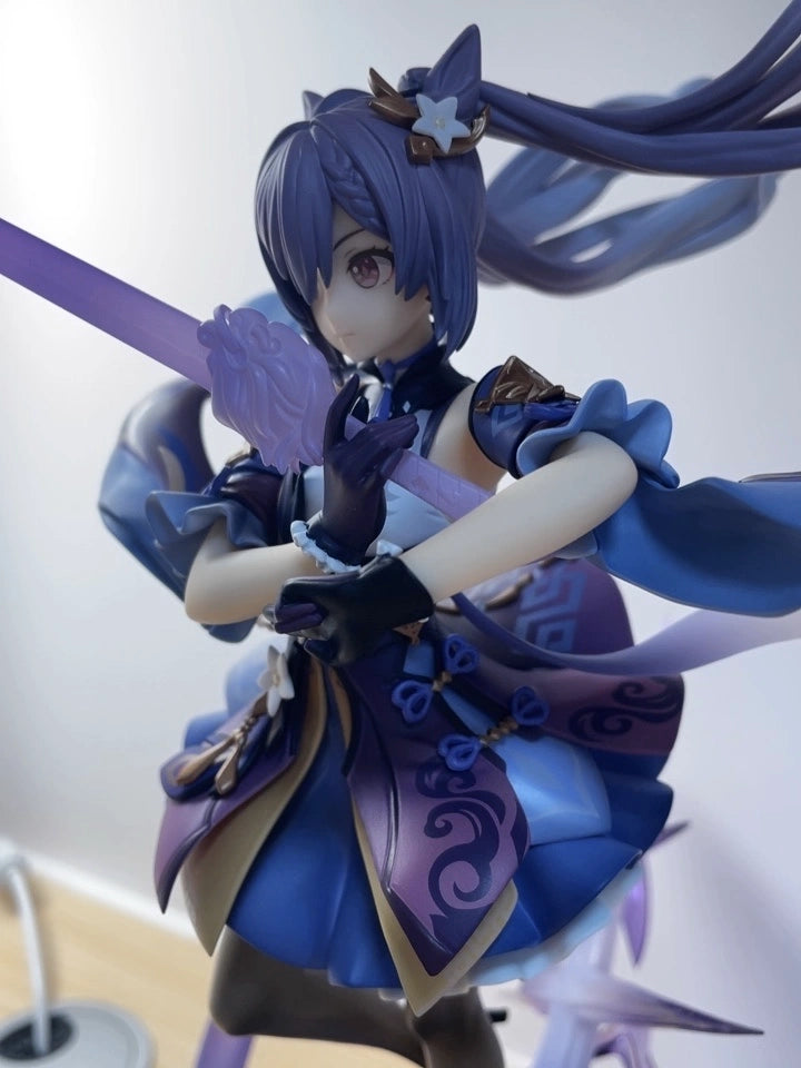Keqing figure detail shot showing flowing hair and outfit textures in customer photo