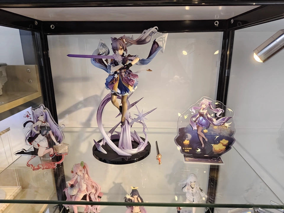 Keqing Genshin Impact figure shown in wide shot with multiple collectibles