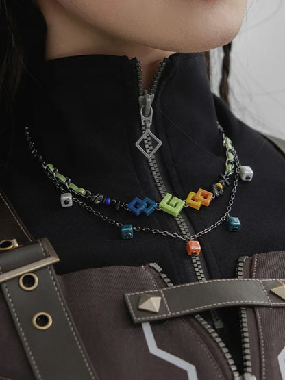 Kinich themed double layer necklace with colorful geometric charms and layered chain details
