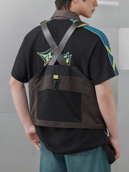 Kinich themed utility vest styled on model showcasing outdoor fashion inspired design and layered look