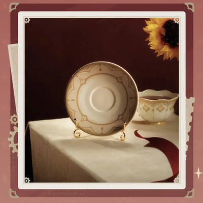 Gold-tone engraved spoon included with the Sandrone tea set