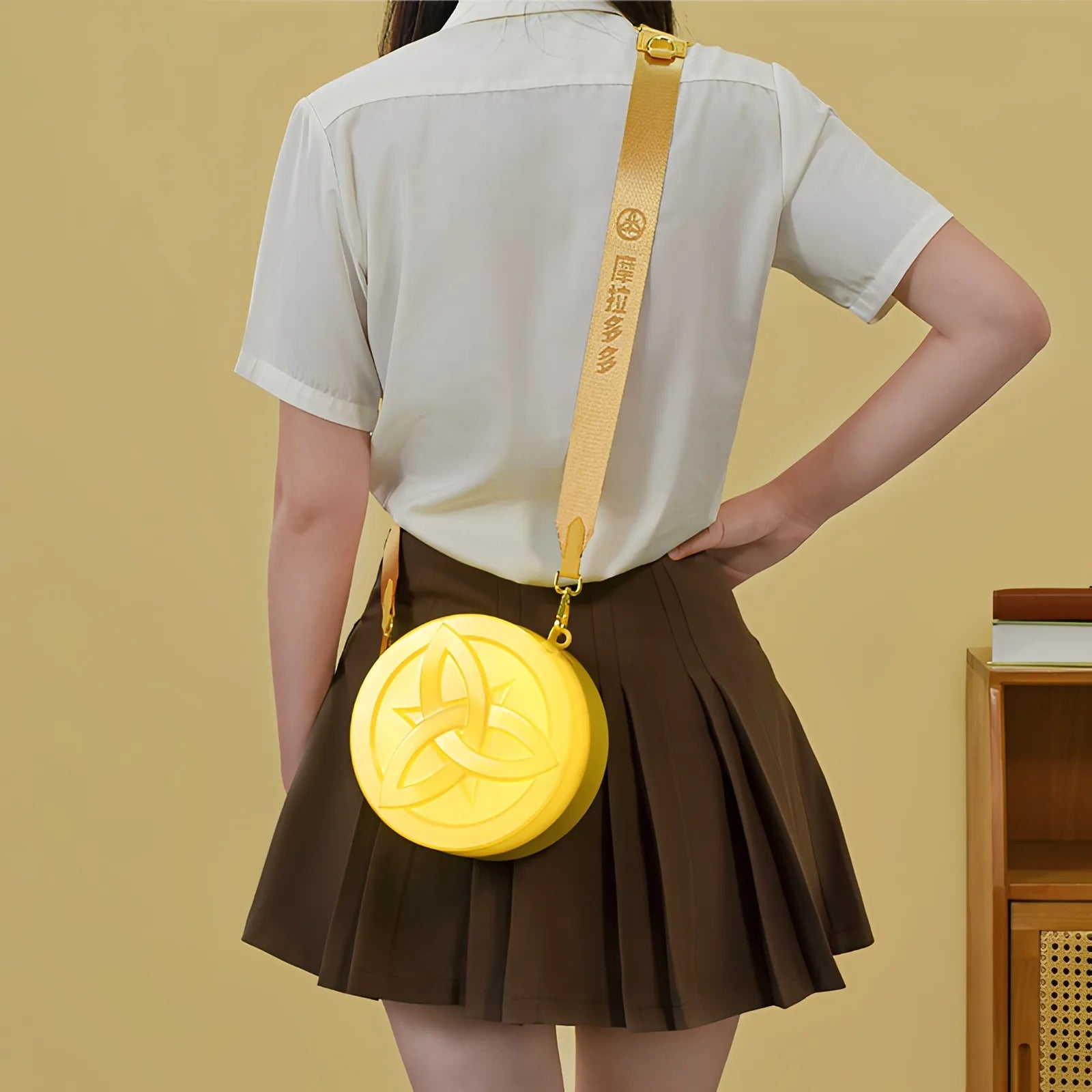 Genshin Mora glowing crossbody bag close-up detail