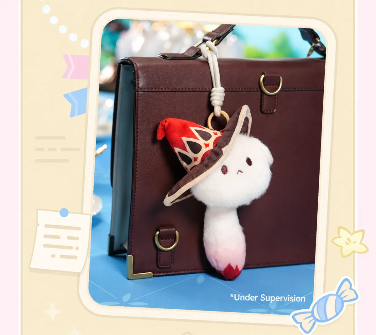 Lumine, Aether and Paimon Tea Party plush charms displayed on a decorative book