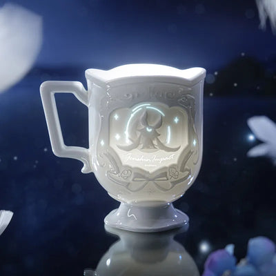 Columbina porcelain cup with celestial relief design and translucent details