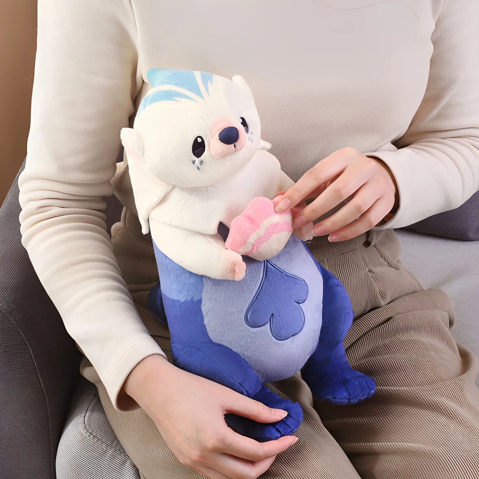 Genshin Impact Yoyo Sea Otter plush keychain side angle showing full body shape