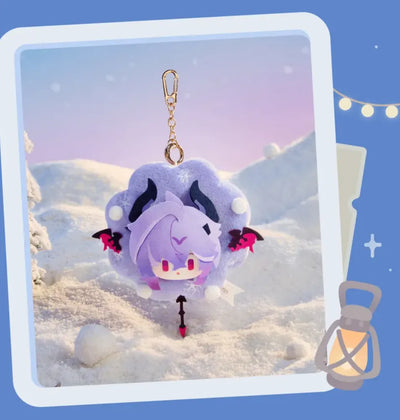 Four character plush charms displayed in a winter setting