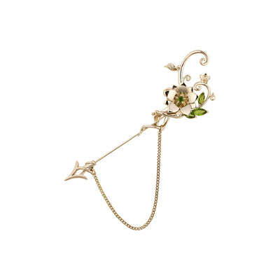 Tighnari brooch on white background featuring floral metal design with chain