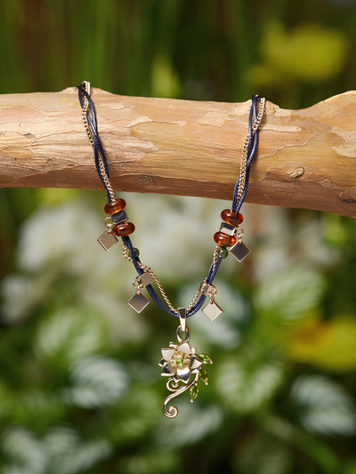 Genshin Impact Tighnari necklace and brooch set featuring floral metal design and layered chain details