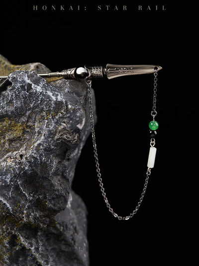 Dan Heng Imbibitor Lunae Hair Stick displayed on dark stone with flowing water and dangling bead chain