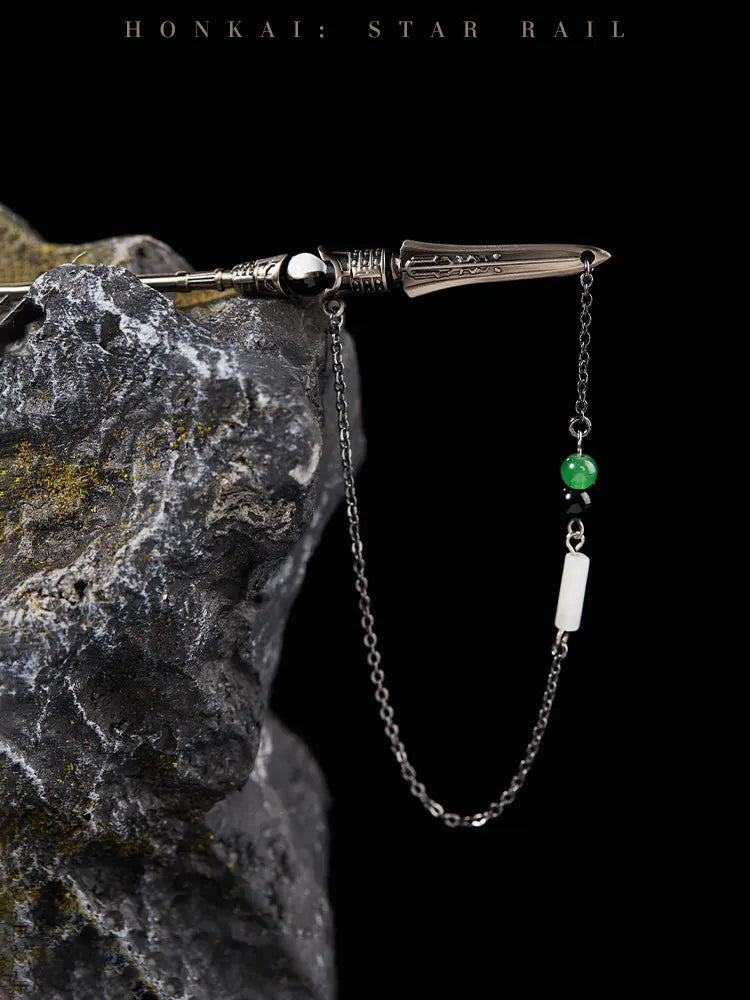 Dan Heng Imbibitor Lunae Hair Stick displayed on dark stone with flowing water and dangling bead chain