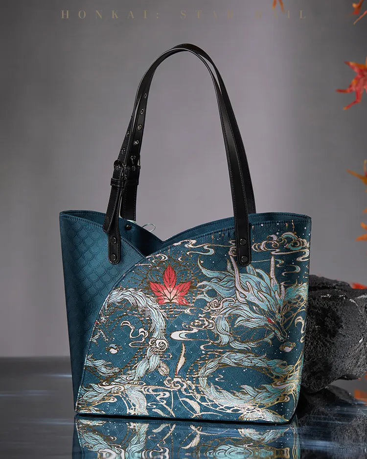 Dan Heng Imbibitor Lunae teal tote bag with gold dragon patterns, black shoulder straps and tassel charm