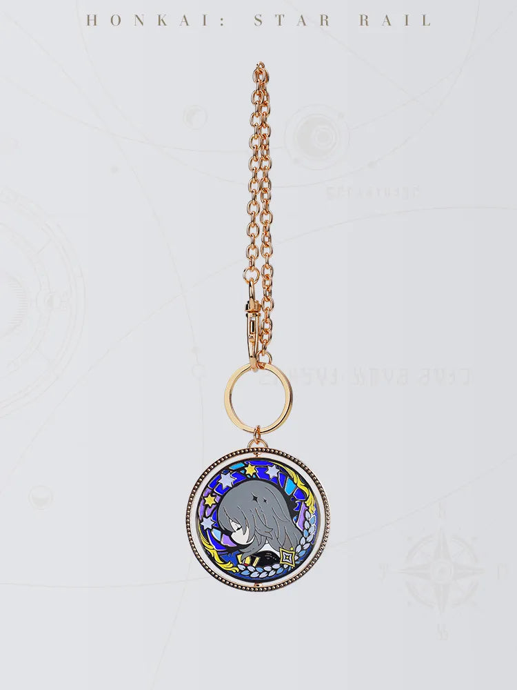 Trailblazer double-sided keychain featuring gold-tone metal frame and colorful star decorations