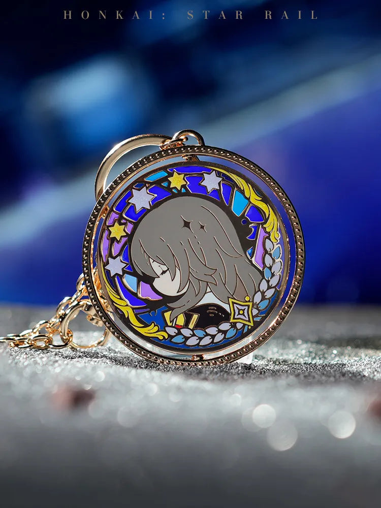 Honkai Star Rail LAND Series Trailblazer double-sided keychain featuring a gold-tone rotating pendant