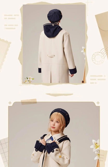 Back detail view of Albedo wool coat with hood embroidery and contrast lining